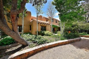 Northern New Mexico vernacular home with traditional adobe and territorial detailing