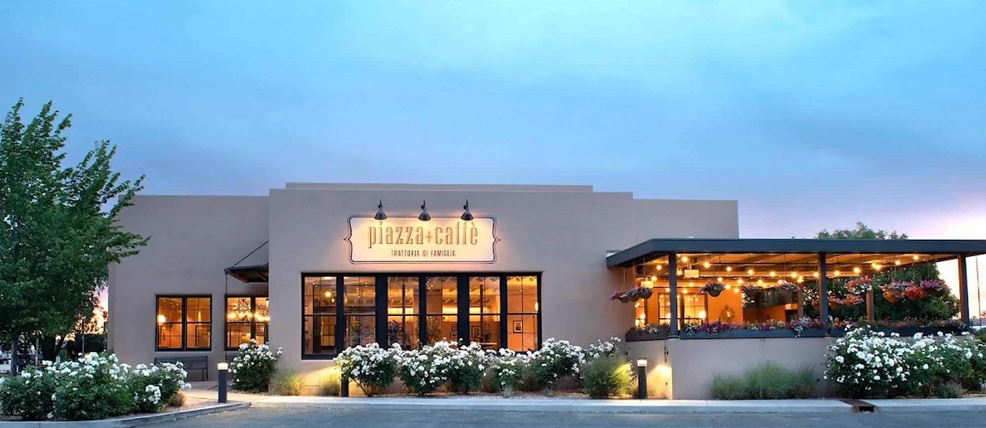 Piazza Caffé, 2574 Camino Entrada, Santa Fe commercial restaurant building at dusk