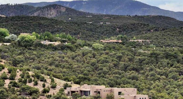 Casa Cielo set in pinon hillside below the Sangre de Cristo foothills at 115 Brownell Howland, Santa Fe