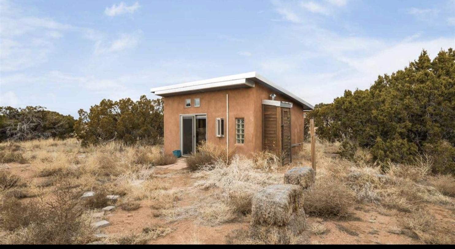 Straw bale guest house and studio in high desert grassland at 119 Old Galisteo, Santa Fe
