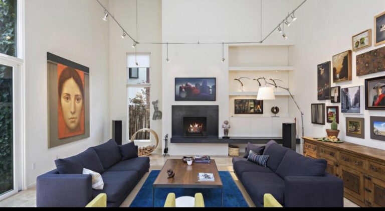 Double height contemporary living room hung with art at 473 Vista Joya, Santa Fe